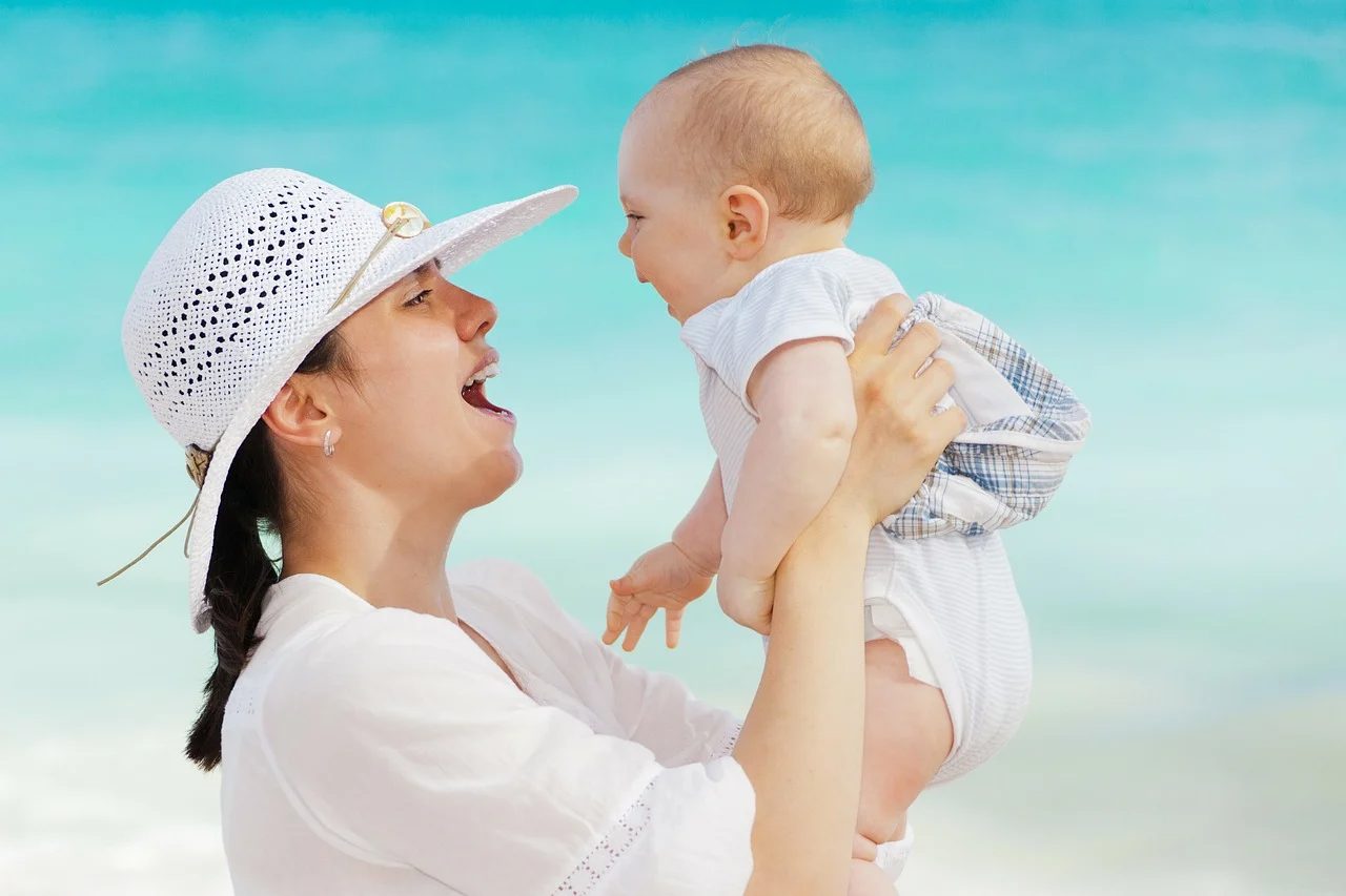 mother and baby at beach